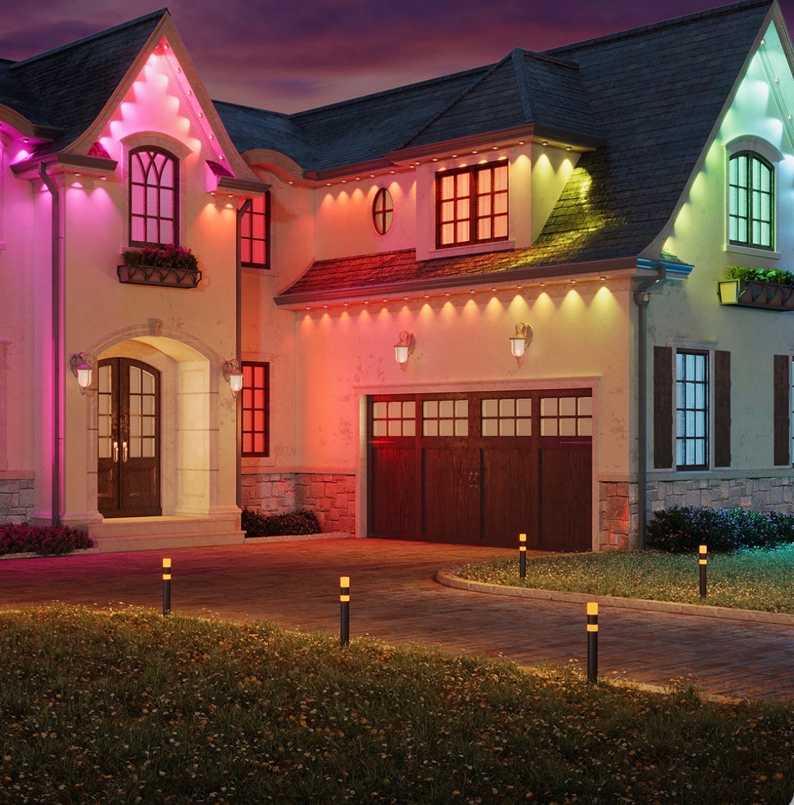Home roofline glowing with colorful permanent lights after dark